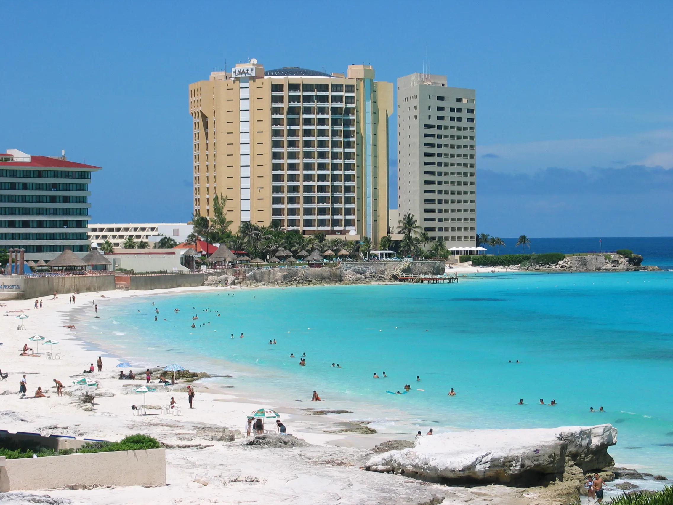 Beachfront resorts lining the white sand and turquoise sea of Cancún